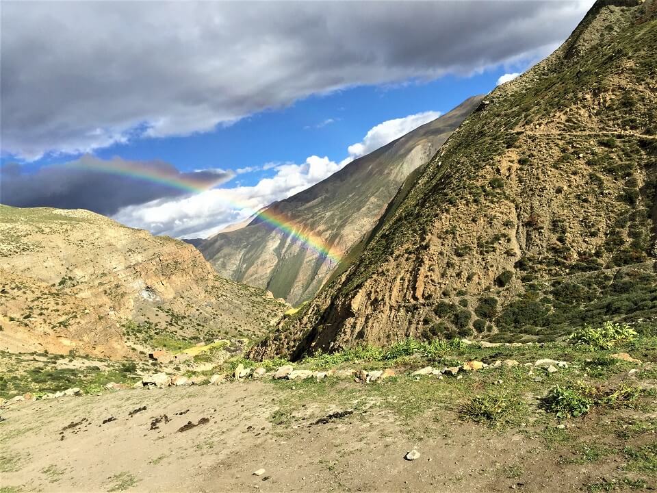 Upper Dolpo trek – rainbow above land scape in Dolpo region